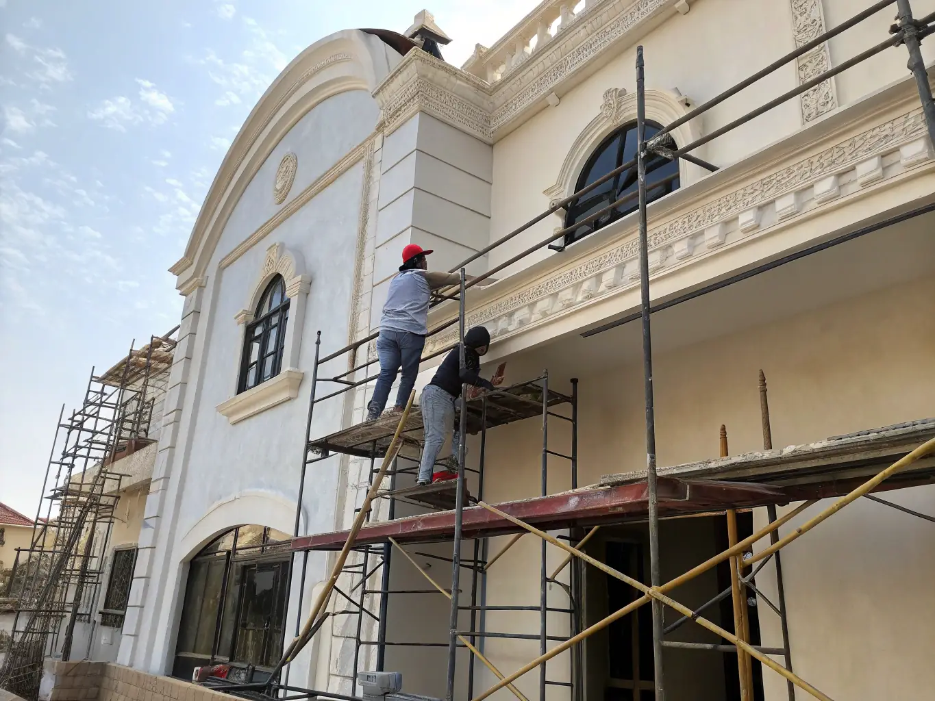 A commercial building undergoing renovation, highlighting modern design and structural integrity. The image captures the transformation from an older structure to a modern, efficient workspace.